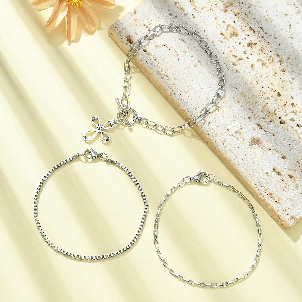 Juego de pulsera con cruz